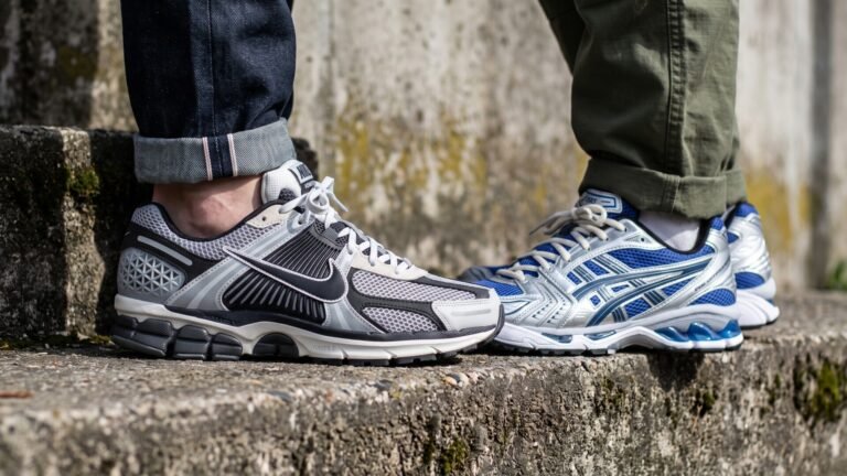 Nike Vomero 5 and ASICS Gel-Kayano 14 sneakers worn side by side on a concrete ledge